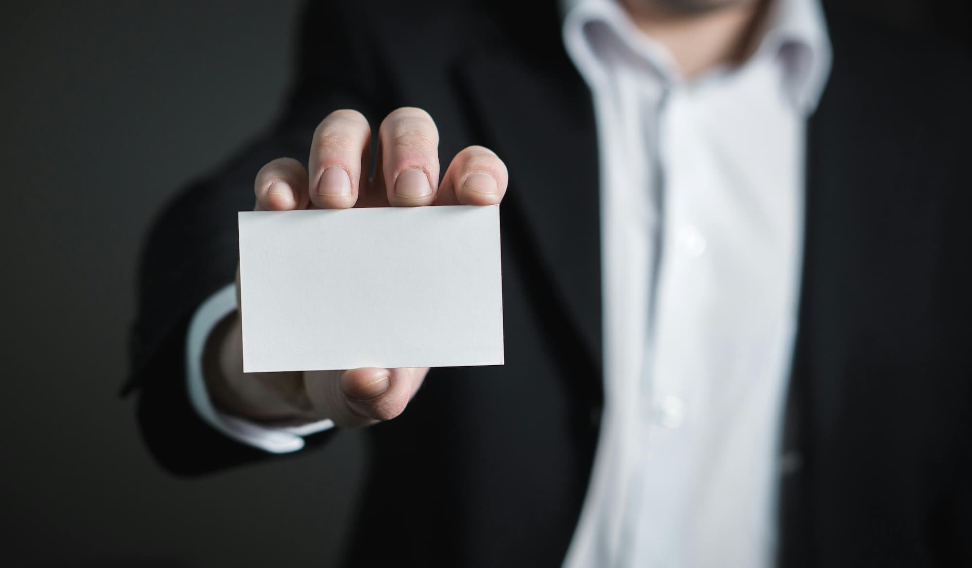 Man holding a business card